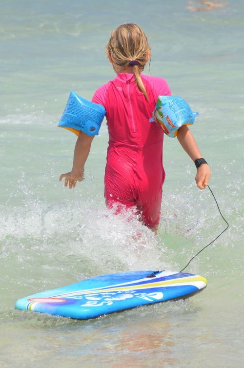 child waves surf
