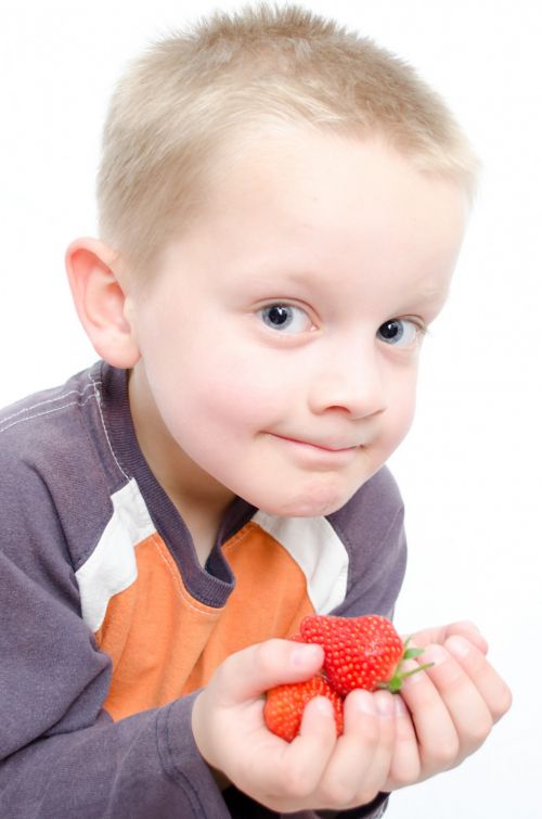 Child And Strawberries