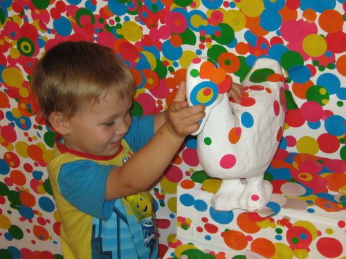 Child Doing Art Kusama Exhibit