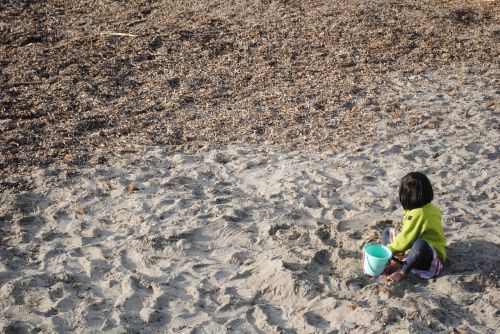 child playing in sand little girl girl