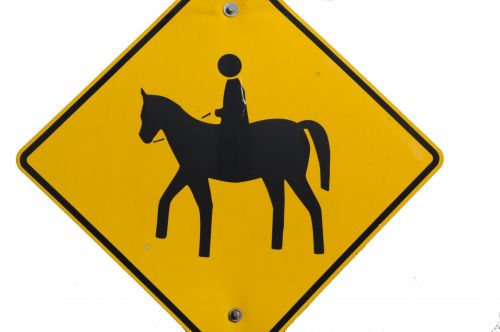 Child Riding Horse Sign
