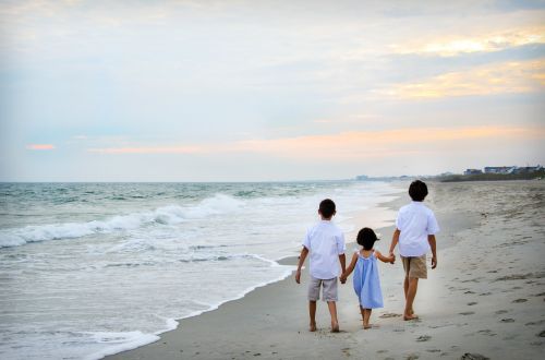 children walking holding hands