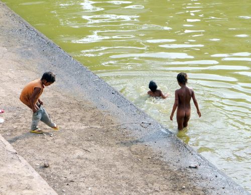 children swim water