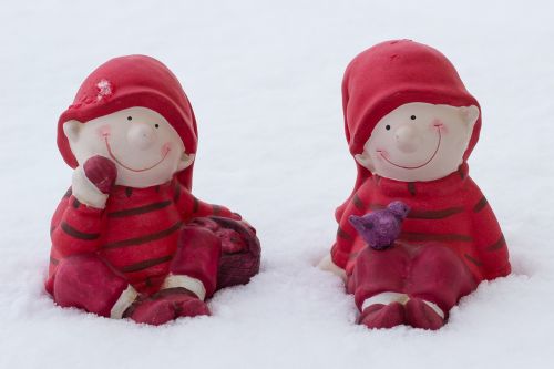 children in the snow figures in the snow wintry