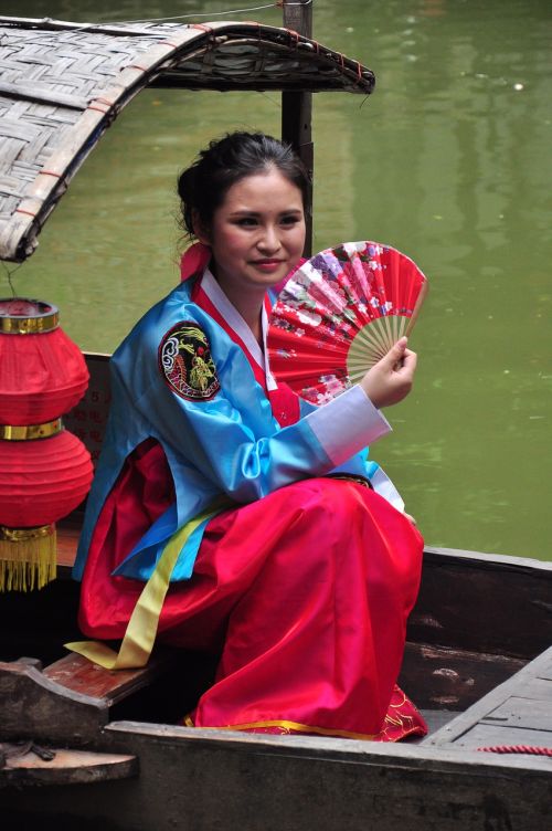 chinese woman with fan chinese woman on boat chinese woman