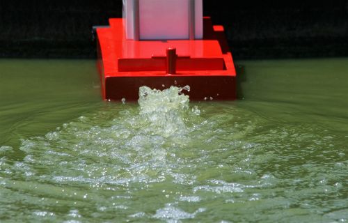 Churned Up Water Behind Model Boat