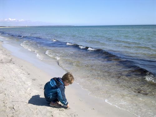 cild plays at the beach children beach