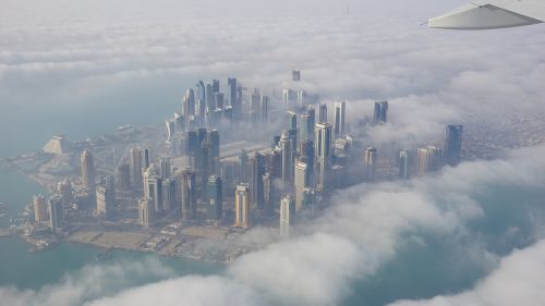 city skyscraper clouds