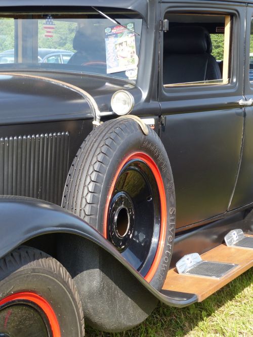 classic car spare wheel grass