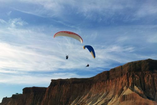 cliff sky parachute