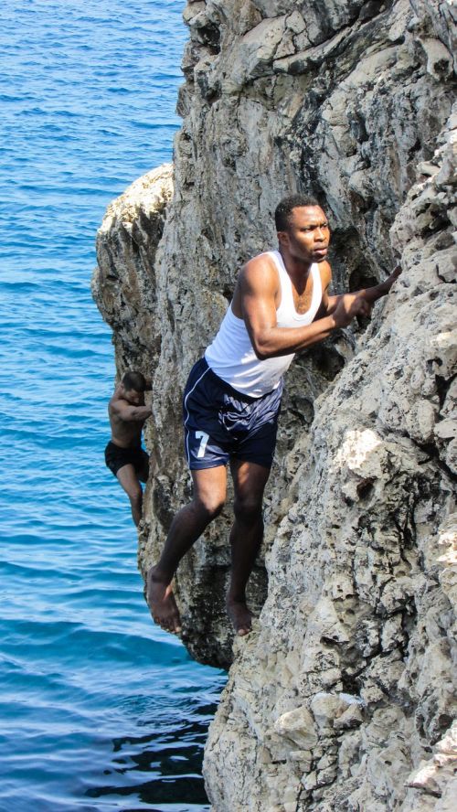 climbing rock sea