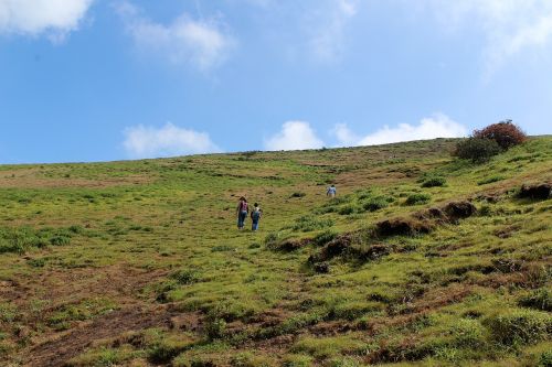 climbing hill blue green