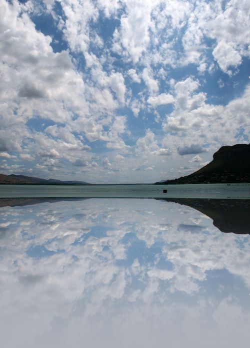Cloud Reflection Over Dam Water