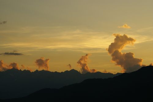 clouds mountains sun