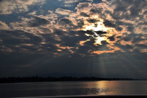 clouds sun lake constance