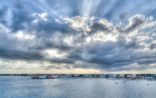 clouds sun rays water