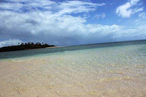 Clouds And The White Sand Beach