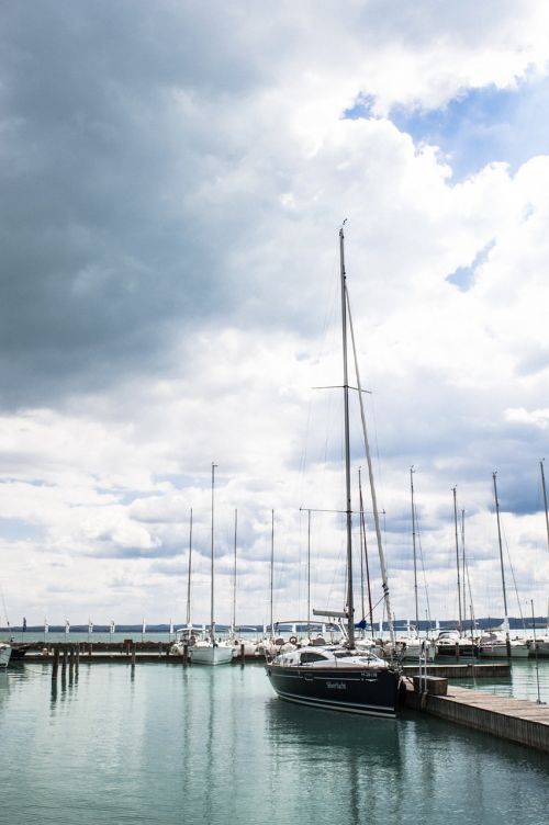 cloudy water sailboat