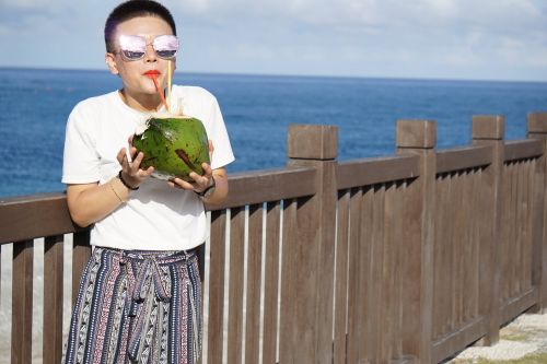 coconut drinking beach