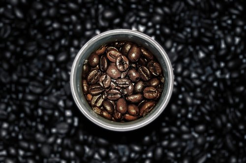 coffee cup  coffee beans  wooden table