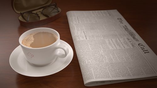 coffee cup  newspaper  table