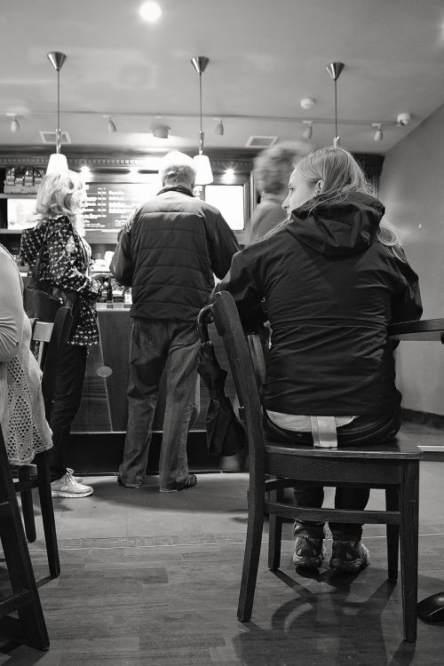 coffee shop woman waiting for friend people queuing