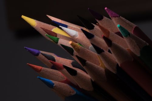 colored pencils wooden pegs pens