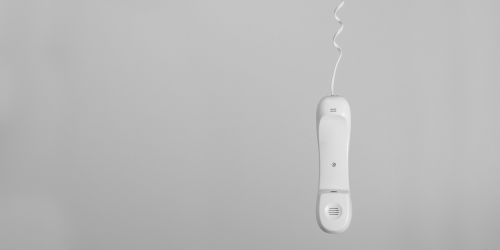 conceptual black and white telephone hanging