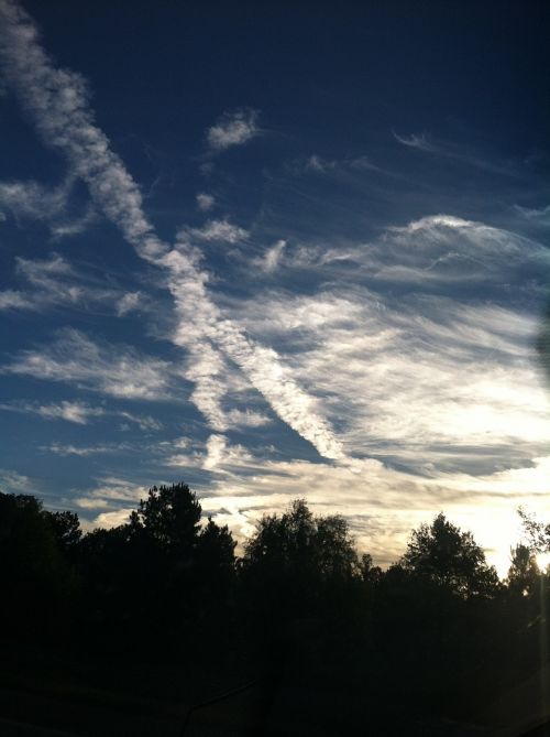 condensation trail vapor trail blue sky