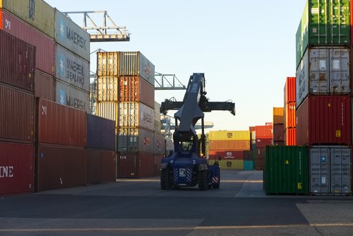 container  loading crane  sunrise