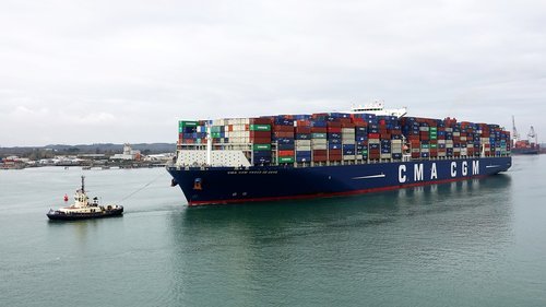container ship  cargo ship  tug