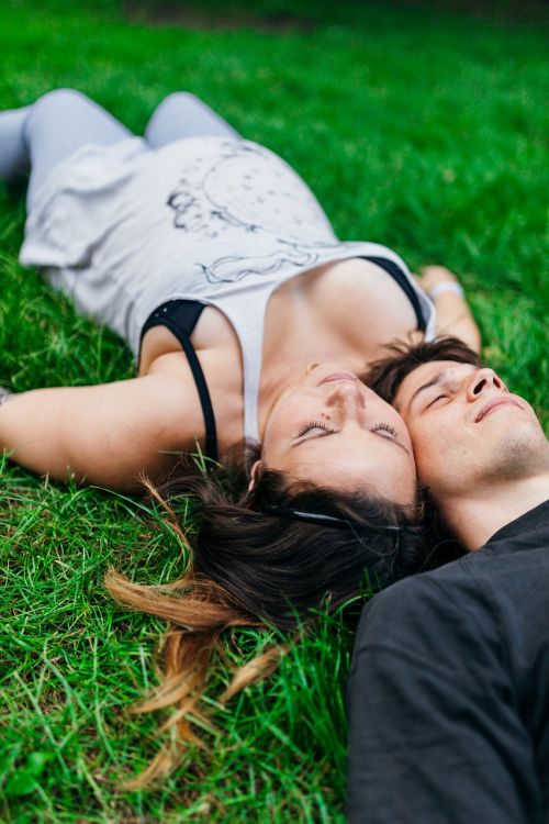 couple laying grass