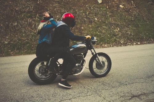 couple driving motorcycle