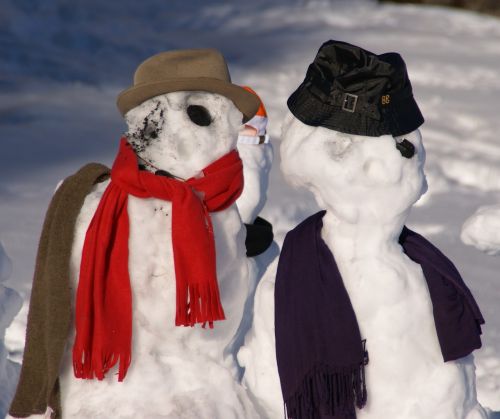 snow man couple winter