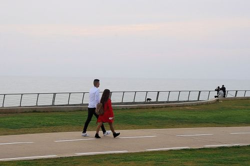 Couple Strolling Near Beach
