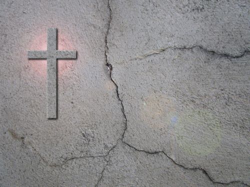 Cross And Cracks On Wall