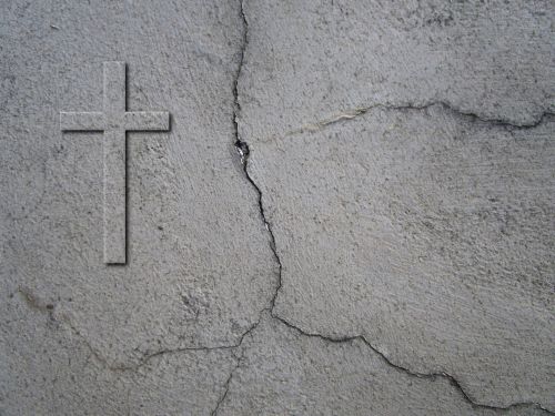Cross And Cracks On Wall