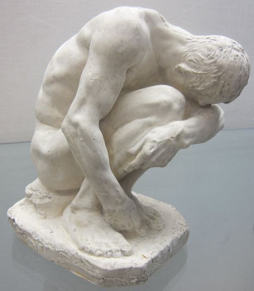 crouching statuette adam