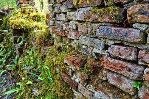 crumbling brick wall  crumbling wall  wall
