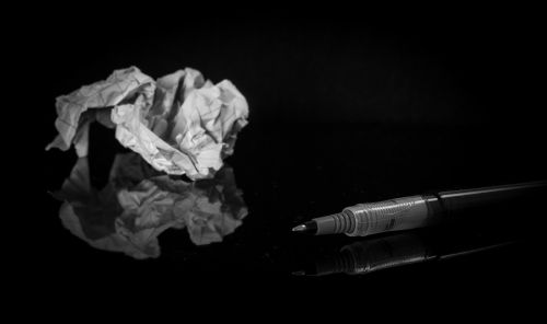 crumpled paper paper pen