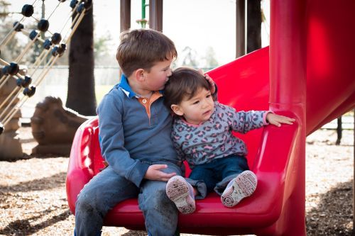 cute kids hug girl