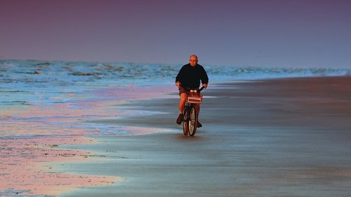 cyclist  beach  morning