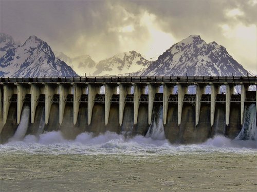 dam  water flow  mountains