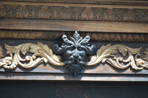 devil carving wood architecture