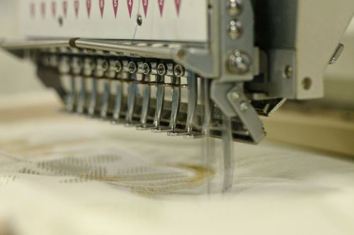 embroiderer sewing cloth