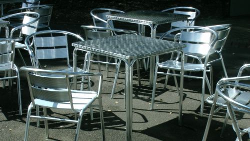 Empty Aluminum Tables &amp; Chairs