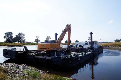 excavators barges river