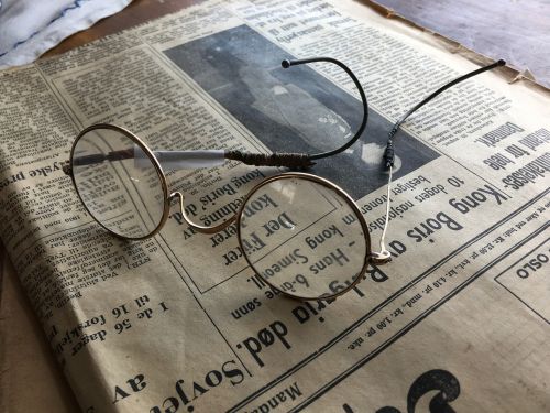 eye glasses old glasses newspaper