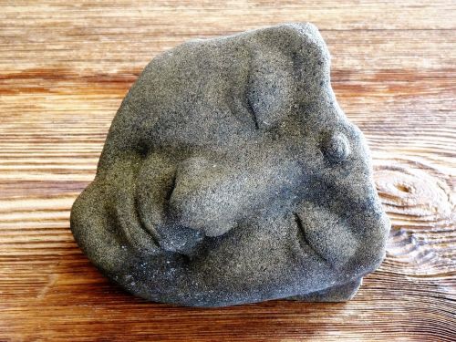 face mask stone figure