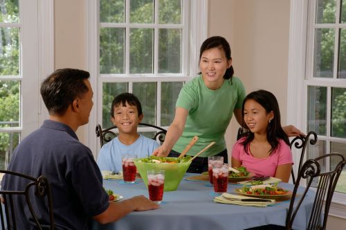 family eating at the table dining parents